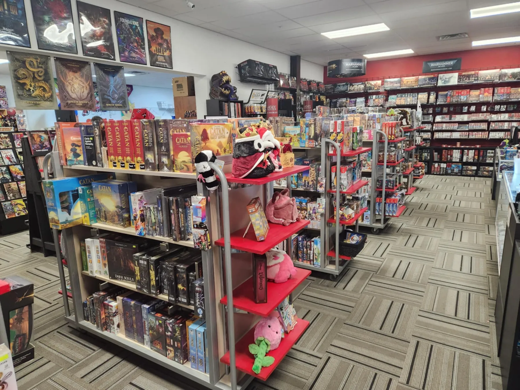 Floor-to-ceiling board game shelves at Born to Game Dover